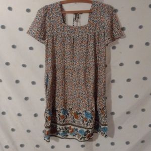 Adorable cottage core smock style floral mini dress with tie shoulder back